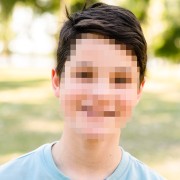 Pixelated photo of smiling tween boy